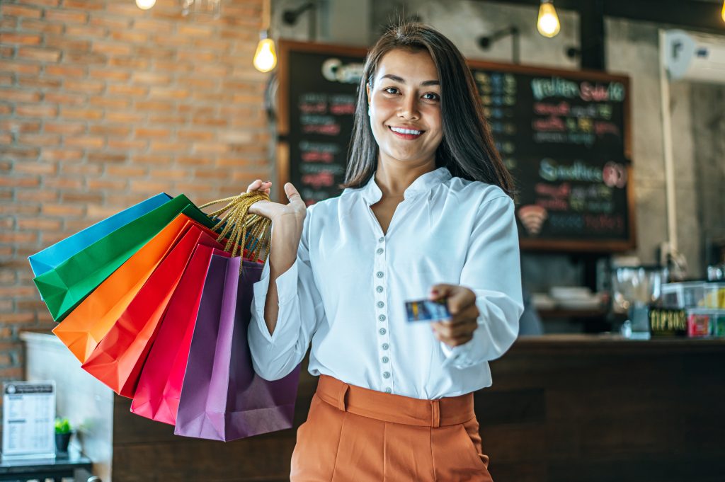 young-women-enjoy-shopping-with-credit-cards-2