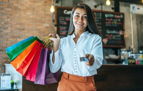 young-women-enjoy-shopping-with-credit-cards-2