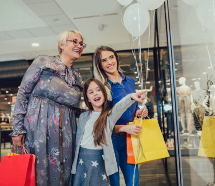 mother-adult-daughter-and-granddaughter-in-shopping-mall-together