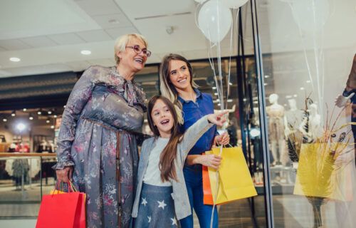 mother-adult-daughter-and-granddaughter-in-shopping-mall-together